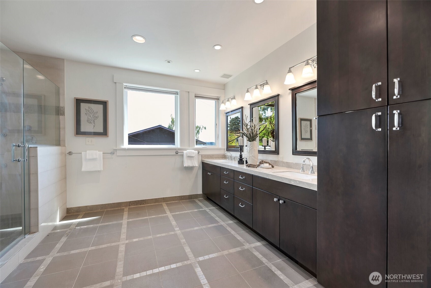 225 Ward Street Seattle, WA 98109 - Photo 20 of 36 a large kitchen with a wooden floor and cabinets