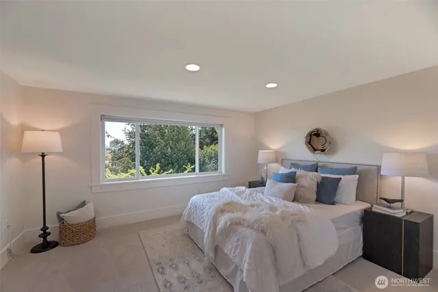 a bathroom with a granite countertop sink a mirror and a bathtub