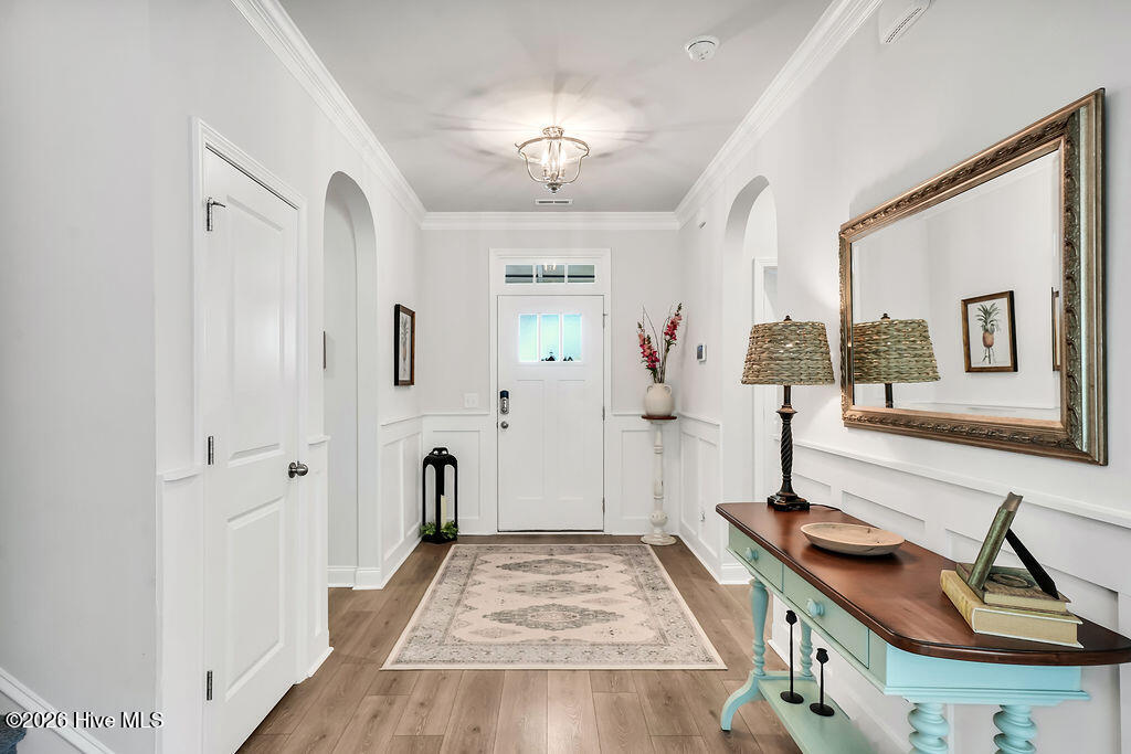 142 Rice Marsh Way Wilmington, NC 28412 - Photo 7 of 64 A wide foyer transitions into an open great room consisting of a large living room, enormous kitchen, and dining area.