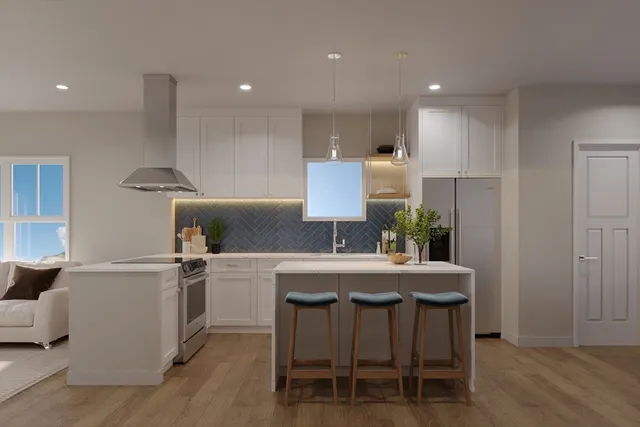 a kitchen with a table and chairs