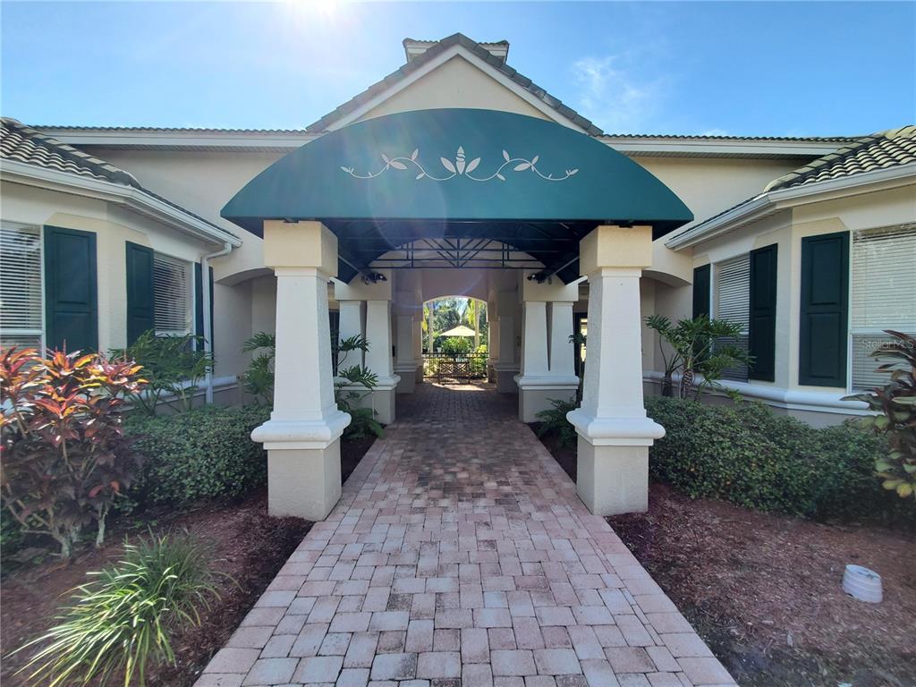 5174 Northridge Road, Unit 209 Sarasota, FL 34238 - Photo 18 of 25 a front view of a house with garden