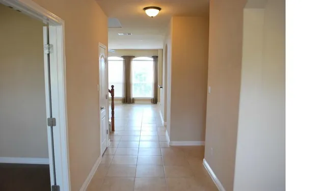 a view of a hallway with a rooms