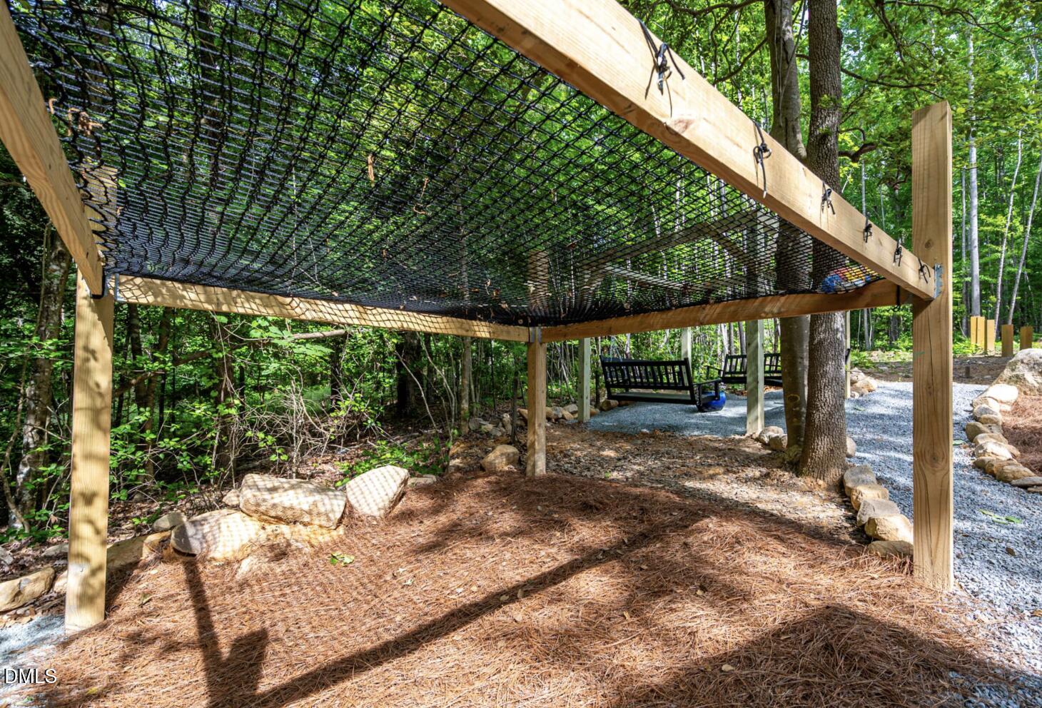 286 Stone Wall Road Pittsboro, NC 27312 - Photo 63 of 71 a backyard of a house with a large tree
