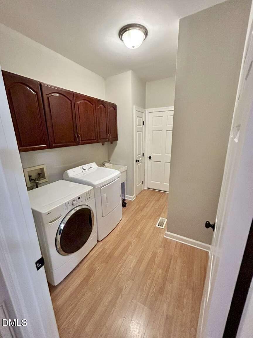 113 Ravenna Way Cary, NC 27513 - Photo 11 of 39 a storage room with washer and dryer