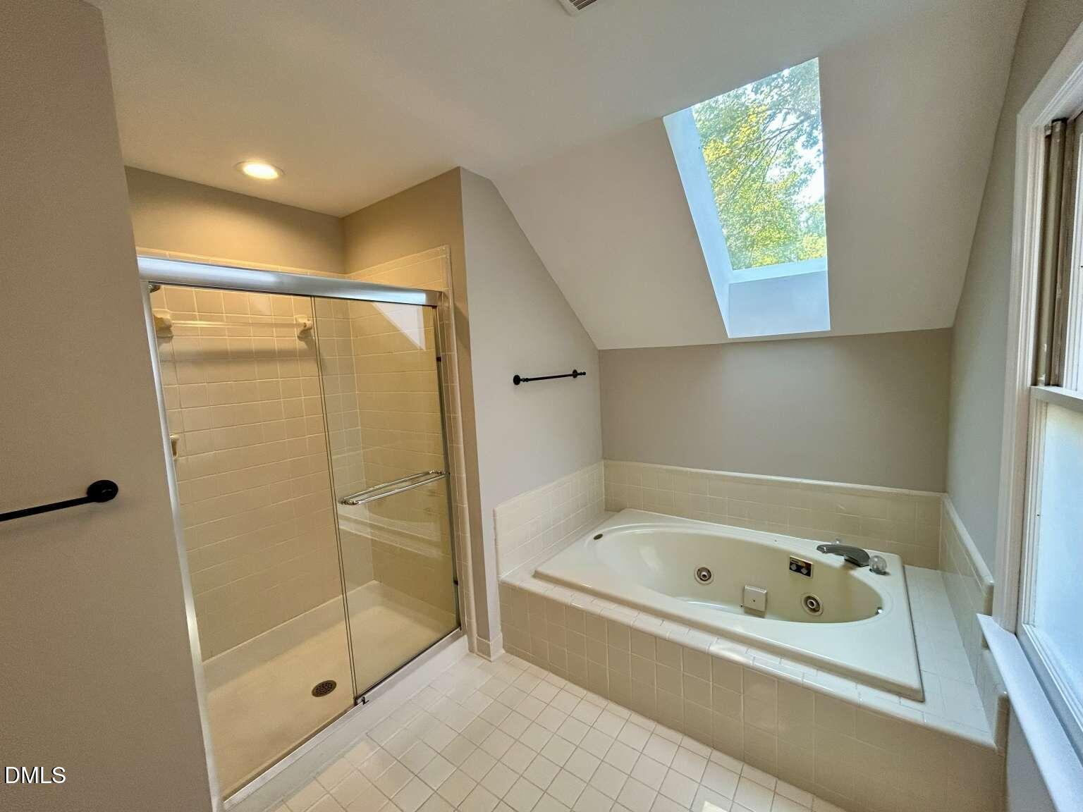113 Ravenna Way Cary, NC 27513 - Photo 19 of 39 a bathroom with a bathtub and a shower