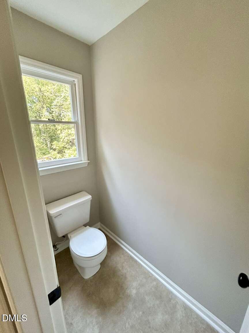 113 Ravenna Way Cary, NC 27513 - Photo 20 of 39 a white toilet sitting next to a window