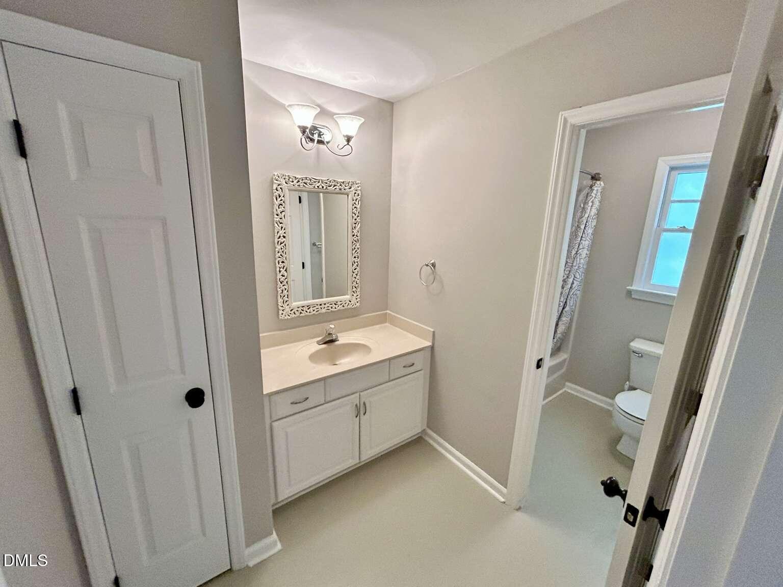 113 Ravenna Way Cary, NC 27513 - Photo 23 of 39 a bathroom with a granite countertop sink toilet and shower