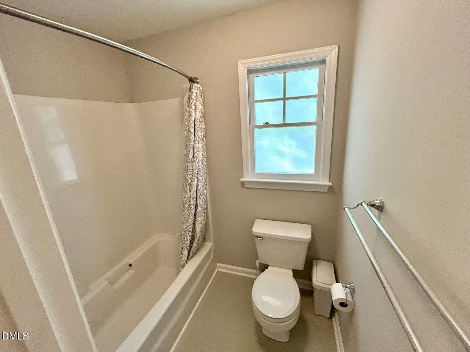 113 Ravenna Way Cary, NC 27513 - Photo 24 of 39 a white toilet sitting next to a bath tub