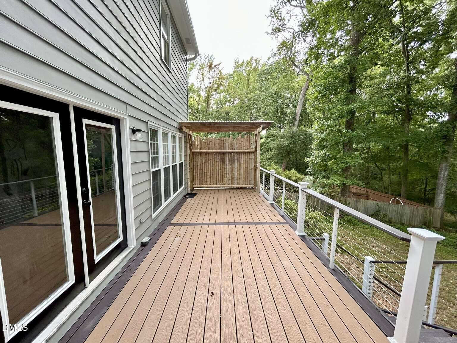 113 Ravenna Way Cary, NC 27513 - Photo 30 of 39 a view of balcony with wooden floor and fence