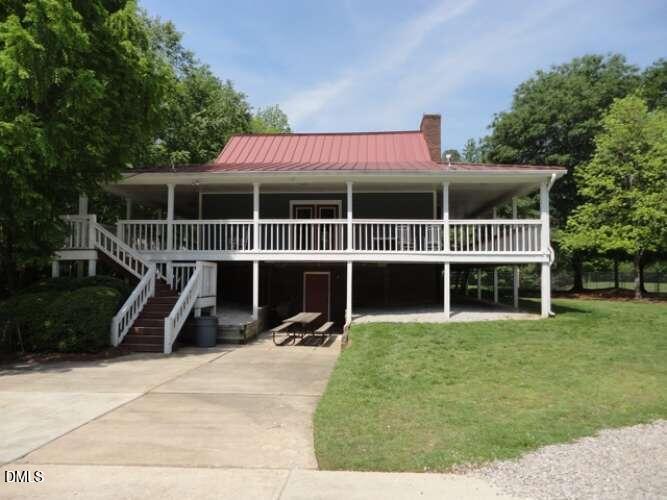 113 Ravenna Way Cary, NC 27513 - Photo 35 of 39 a view of a house with a yard and sitting area