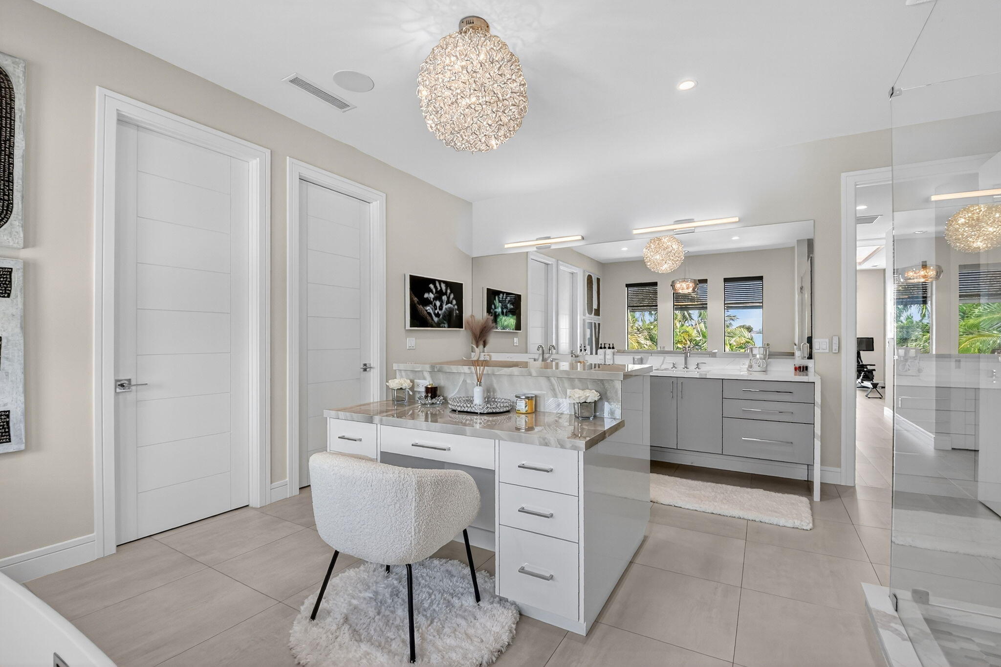 770 Enfield Street Boca Raton, FL 33487 - Photo 58 of 90 a spacious bathroom with a sink a mirror and a shower