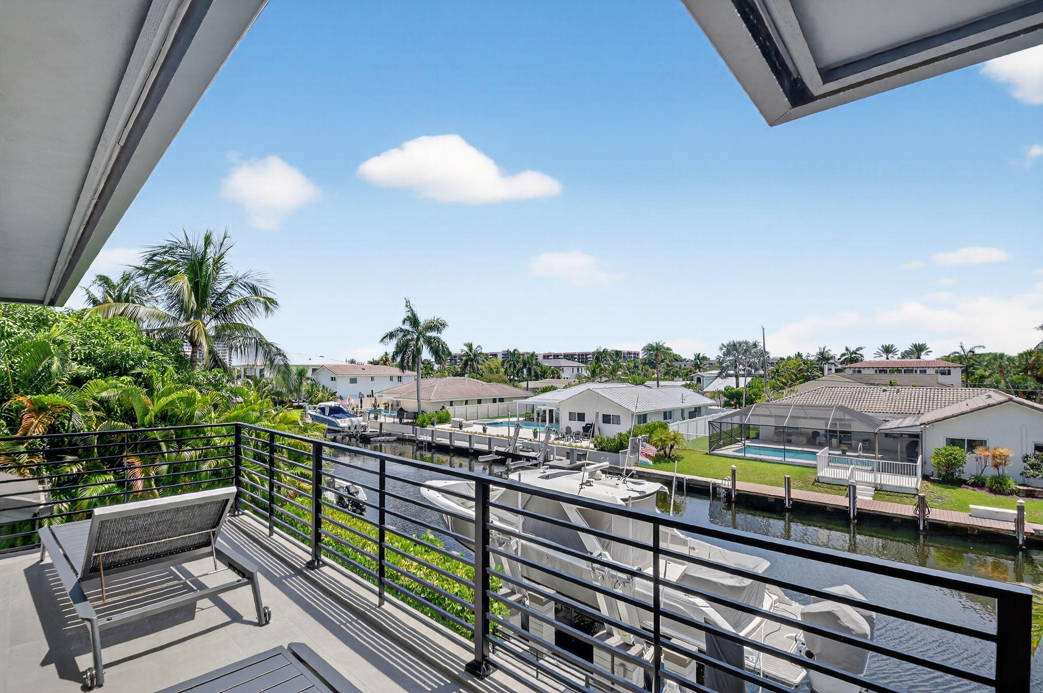 770 Enfield Street Boca Raton, FL 33487 - Photo 67 of 90 a view of a balcony with wooden benches
