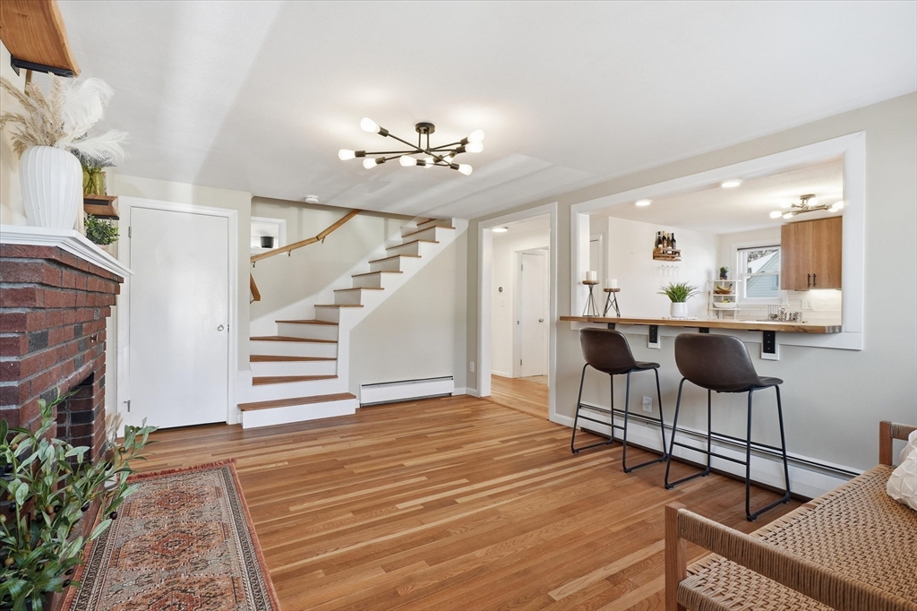 27 Garfield Avenue Saugus, MA 01906 - Photo 11 of 41 a view of a livingroom with furniture and a kitchen