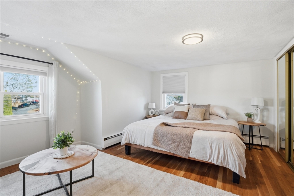 27 Garfield Avenue Saugus, MA 01906 - Photo 26 of 41 a bedroom with a bed and a chair