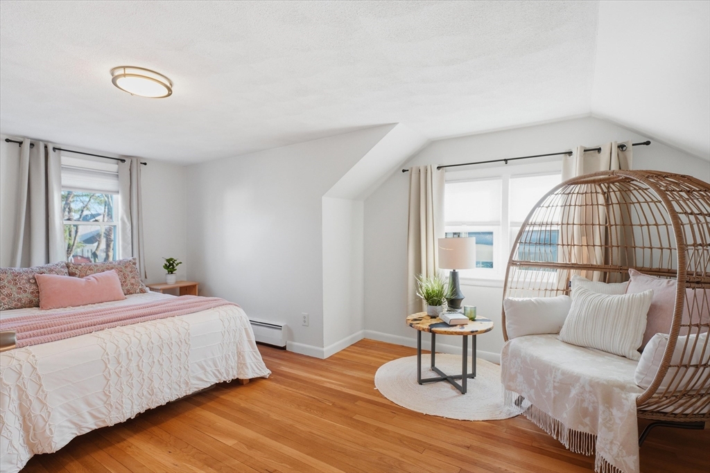 27 Garfield Avenue Saugus, MA 01906 - Photo 28 of 41 a bedroom with a bed and a large mirror