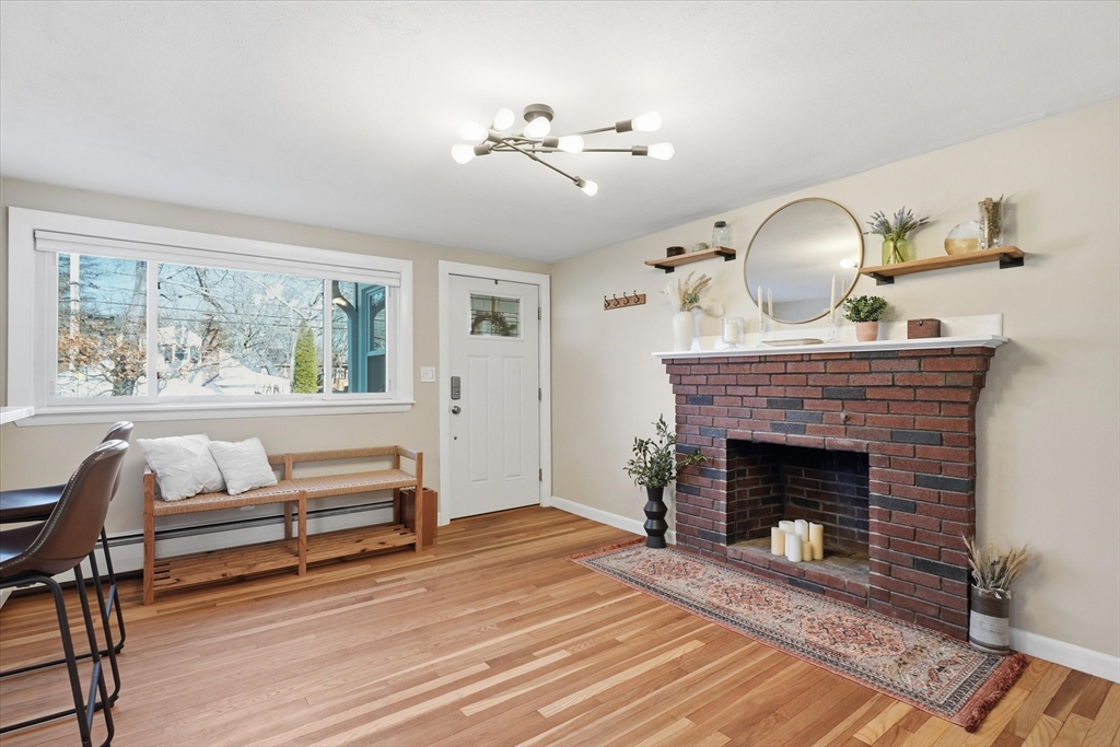 27 Garfield Avenue Saugus, MA 01906 - Photo 3 of 41 a living room with furniture and a fireplace