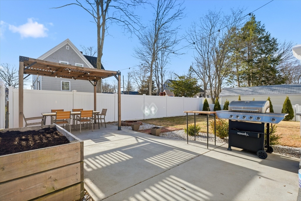 27 Garfield Avenue Saugus, MA 01906 - Photo 34 of 41 a view of a patio with a table and chairs
