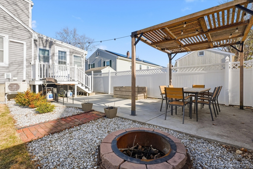 27 Garfield Avenue Saugus, MA 01906 - Photo 37 of 41 a view of a patio with a table and chairs