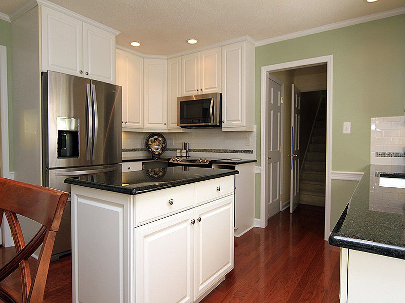 113 Dabney Road Cary, NC 27511 - Photo 6 of 19 The granite island gives both additional work space and storage. There are plenty of cabinets and a Pantry for all of your Kitchen tools/gadgets in addition to all new appliances! Kitchen