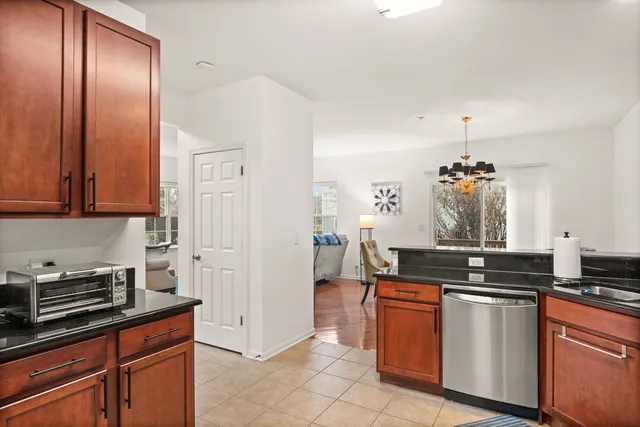 a kitchen with granite countertop a sink and cabinets
