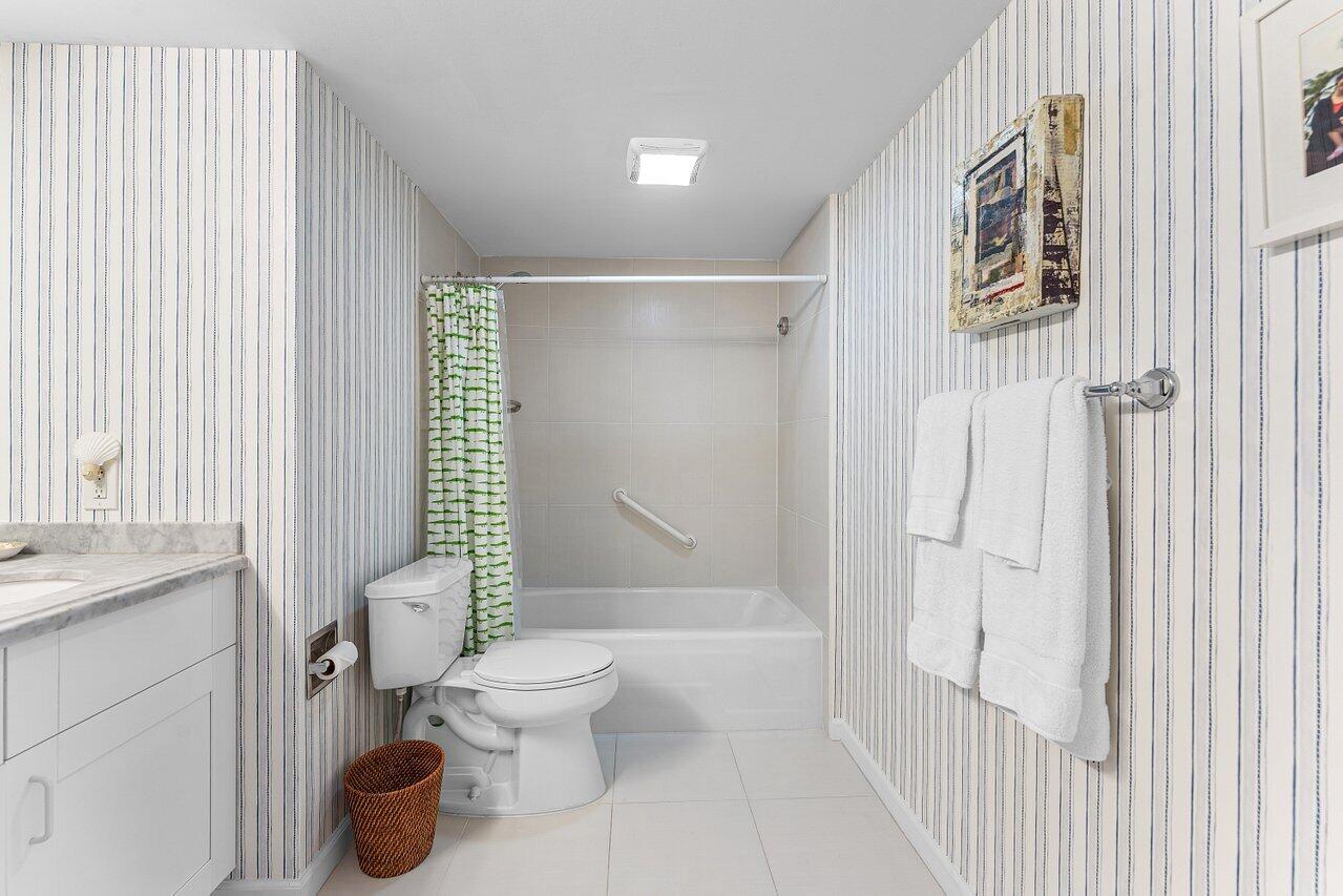 2774 South Ocean Boulevard, Unit 409 Palm Beach, FL 33480 - Photo 11 of 32 a bathroom with a toilet and a shower
