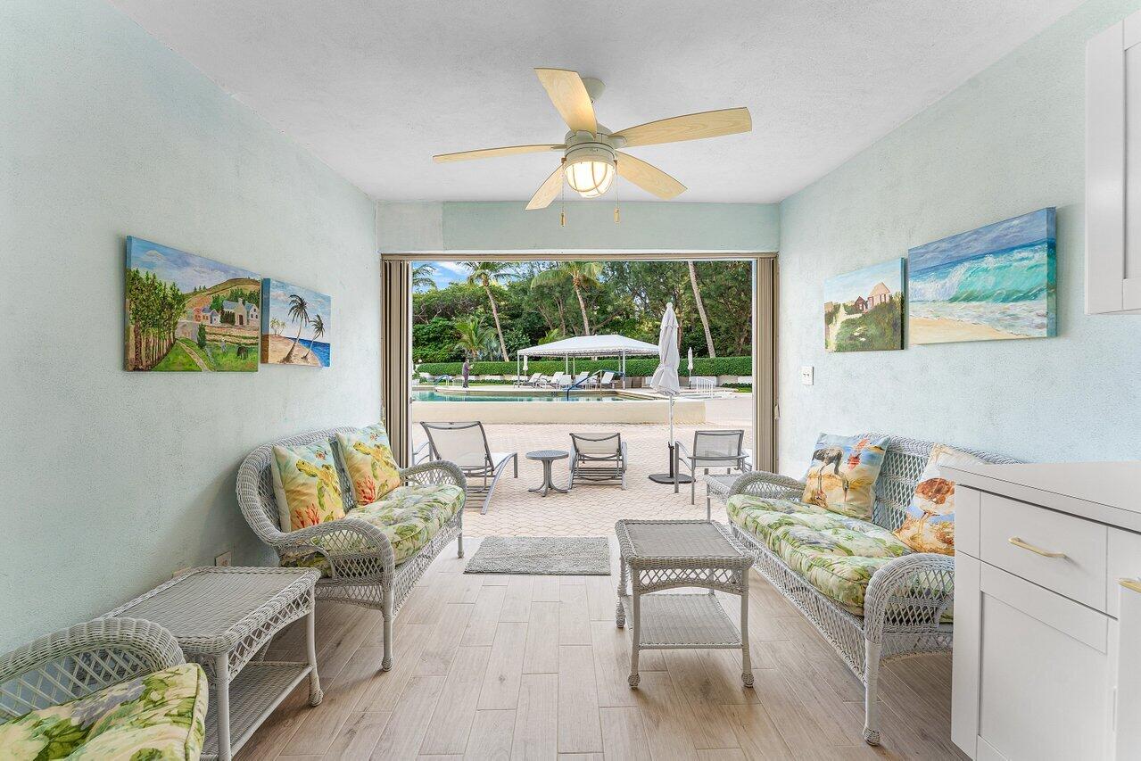 2774 South Ocean Boulevard, Unit 409 Palm Beach, FL 33480 - Photo 15 of 32 a living room with furniture and a large window