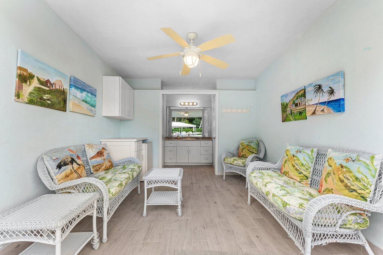 2774 South Ocean Boulevard, Unit 409 Palm Beach, FL 33480 - Photo 16 of 32 a living room with furniture and painting on the wall