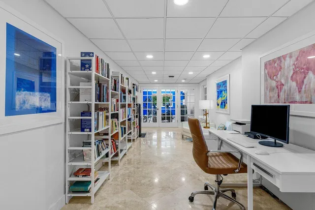 a view of a workspace with furniture