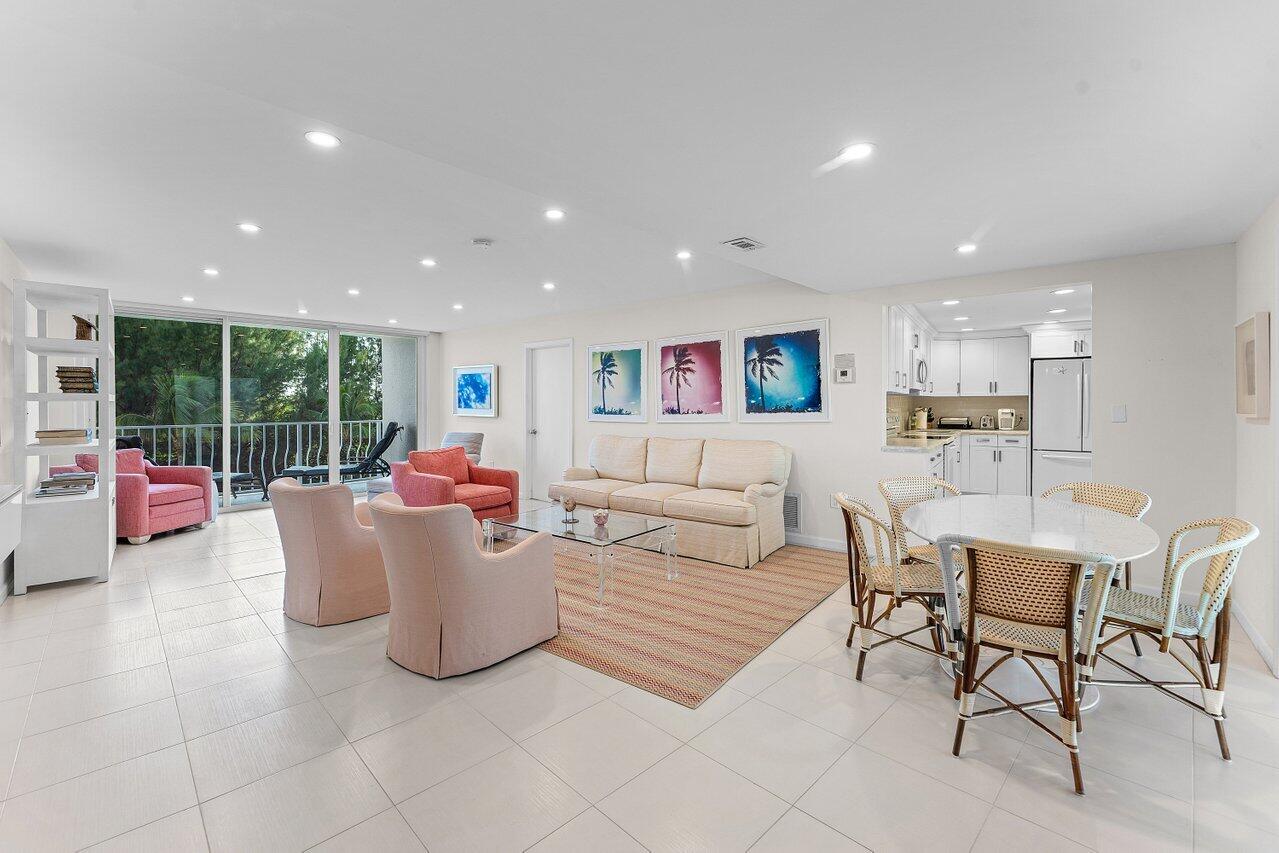 2774 South Ocean Boulevard, Unit 409 Palm Beach, FL 33480 - Photo 3 of 32 a living room with furniture and a large window