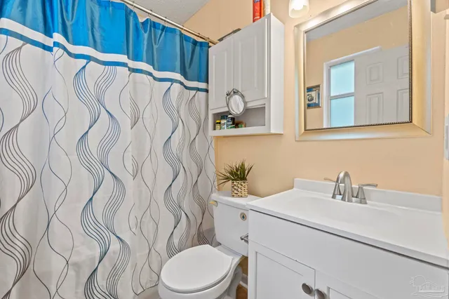 a bathroom with a sink and toilet