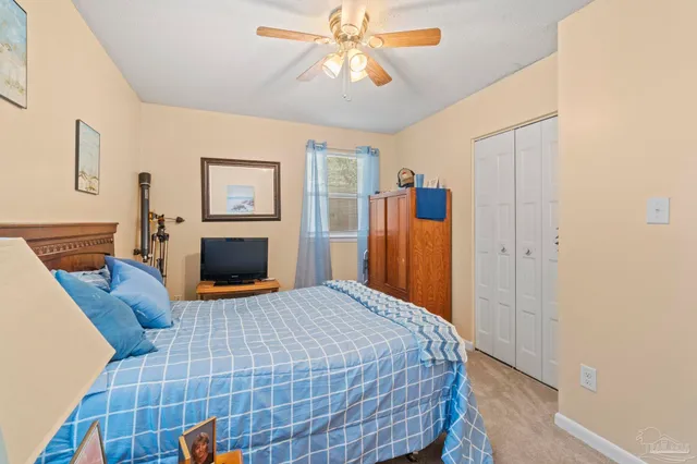 a bedroom with a bed and a fireplace