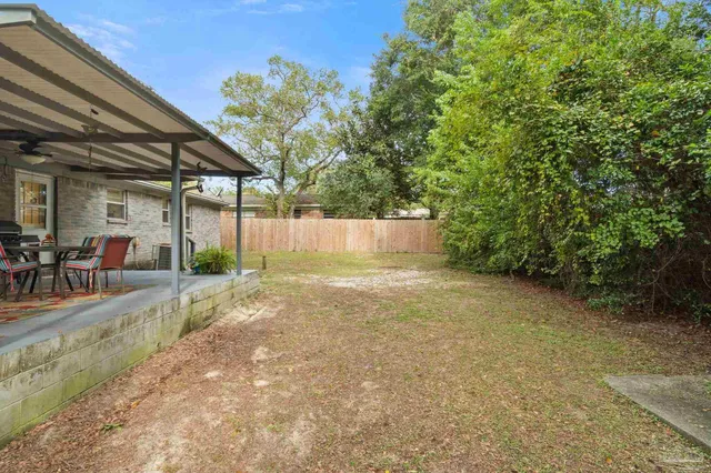 a view of a backyard of the house