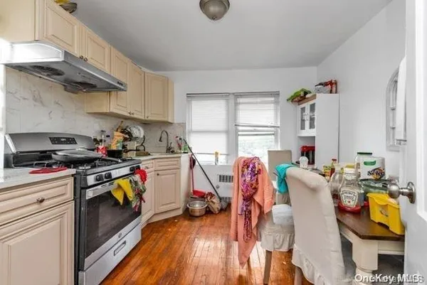 a view of a kitchen with furniture and a window