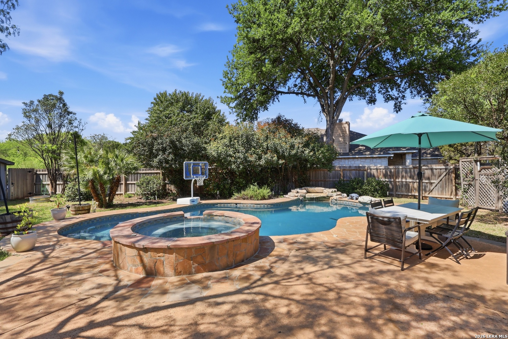 12703 Holly Cedar Helotes, TX 78023 - Photo 2 of 23 a view of a backyard with sitting area