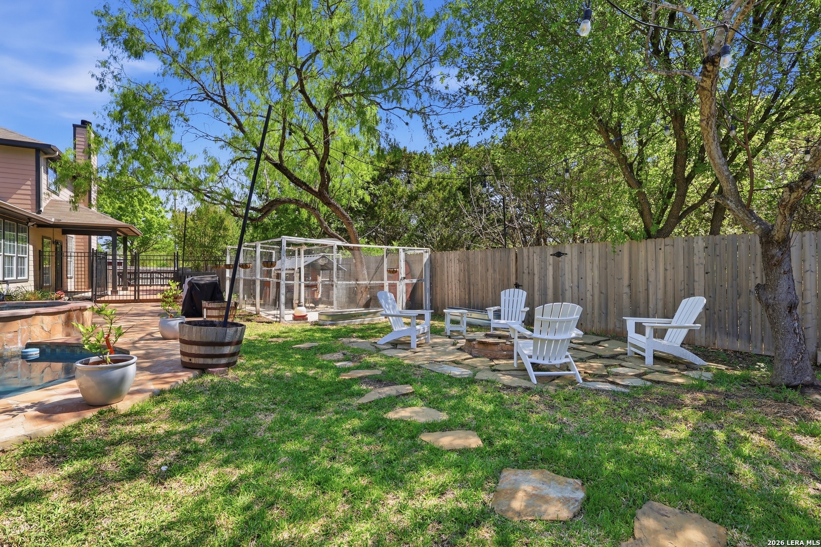 12703 Holly Cedar Helotes, TX 78023 - Photo 3 of 23 a view of a chair and table in the garden