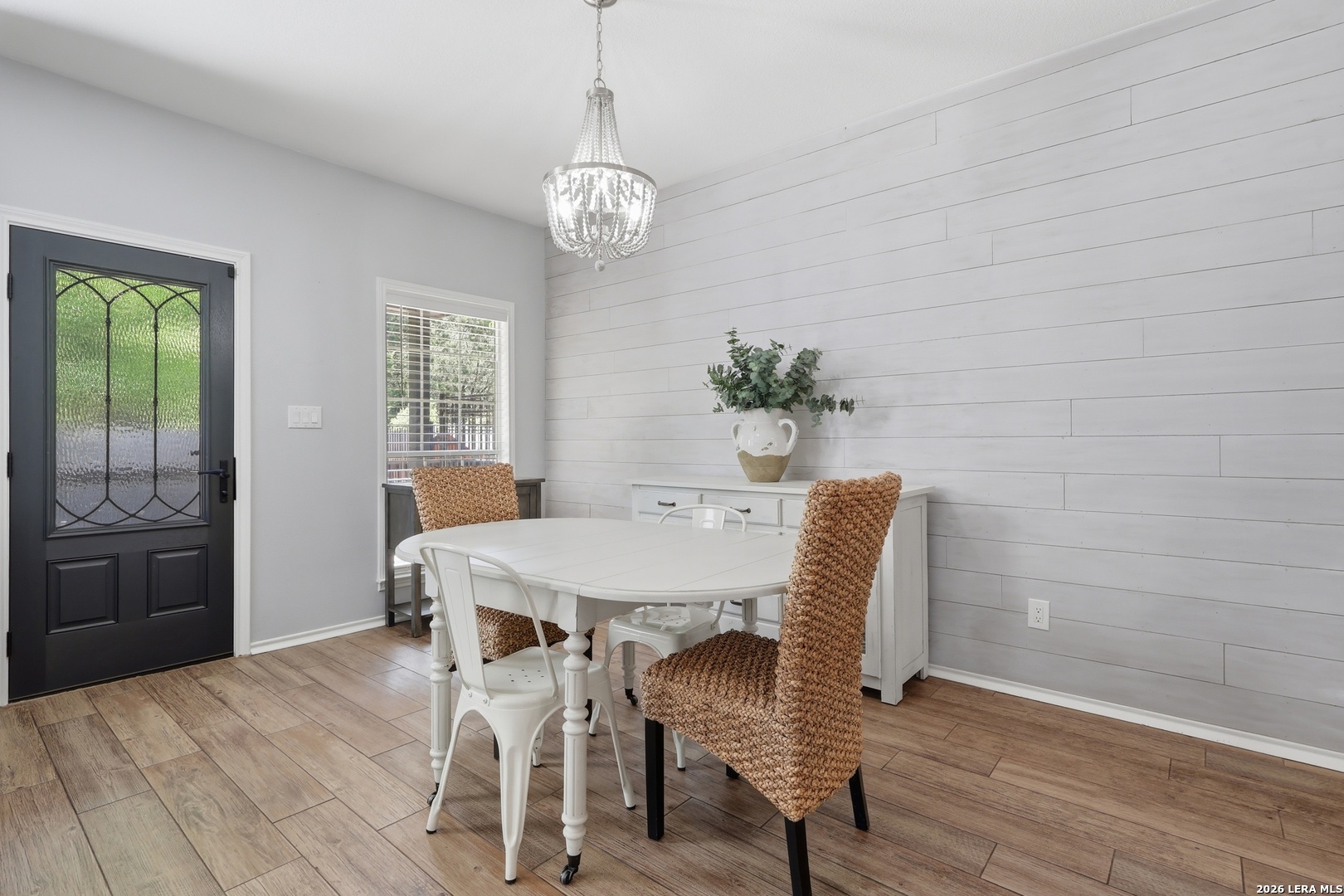 12703 Holly Cedar Helotes, TX 78023 - Photo 7 of 23 a view of a dining room with furniture window and wooden floor
