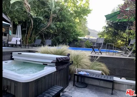 a view of a swimming pool with sitting area