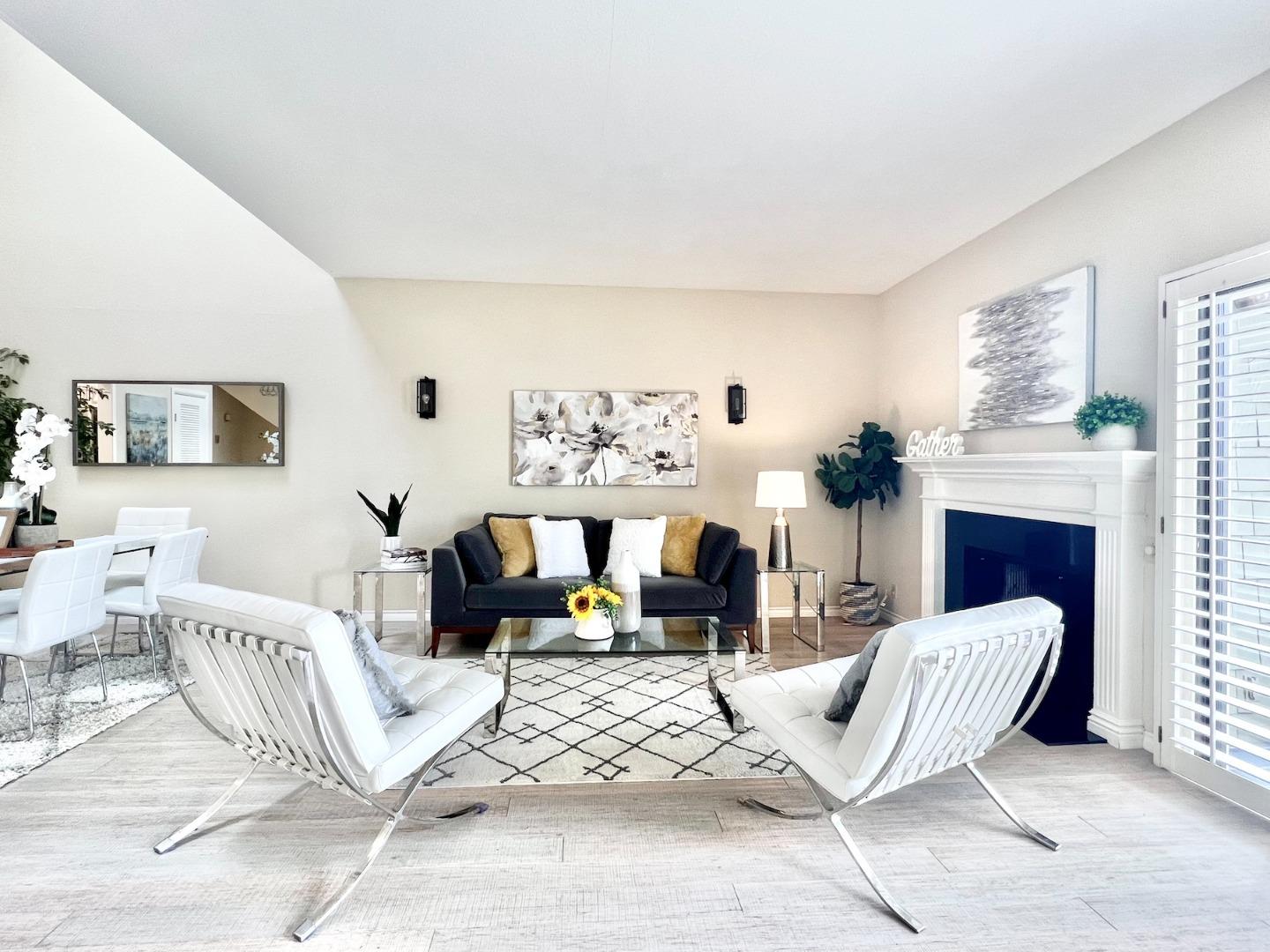 834 Wharfside Road San Mateo, CA 94404 - Photo 1 of 36 a living room with furniture and a fireplace