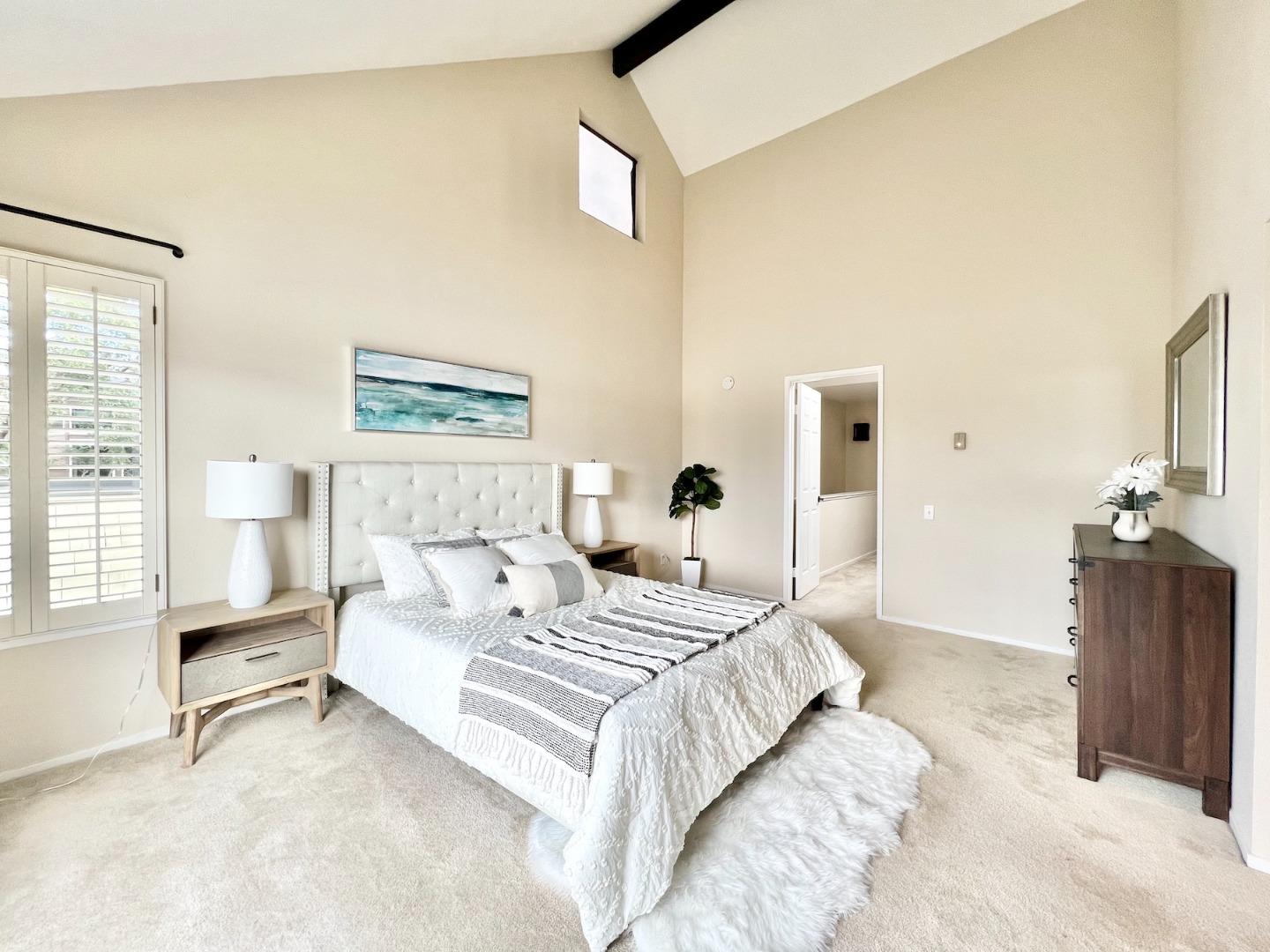834 Wharfside Road San Mateo, CA 94404 - Photo 18 of 36 a bedroom with a bed and a couch