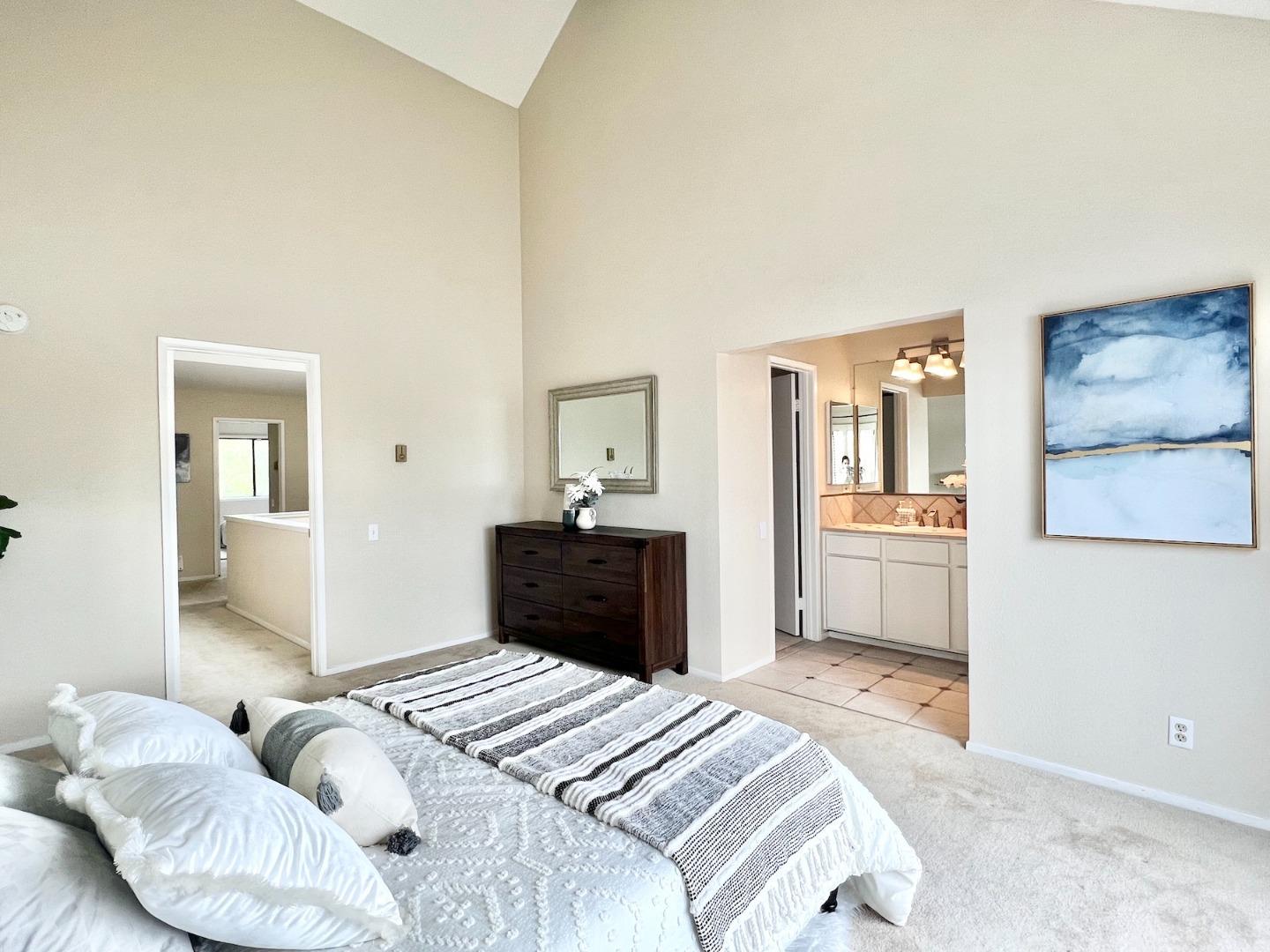 834 Wharfside Road San Mateo, CA 94404 - Photo 19 of 36 a bedroom with a bed and wooden floor