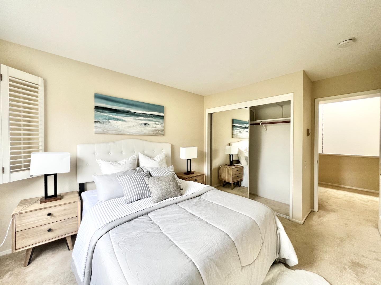 834 Wharfside Road San Mateo, CA 94404 - Photo 20 of 36 a bedroom with a bed and a couch