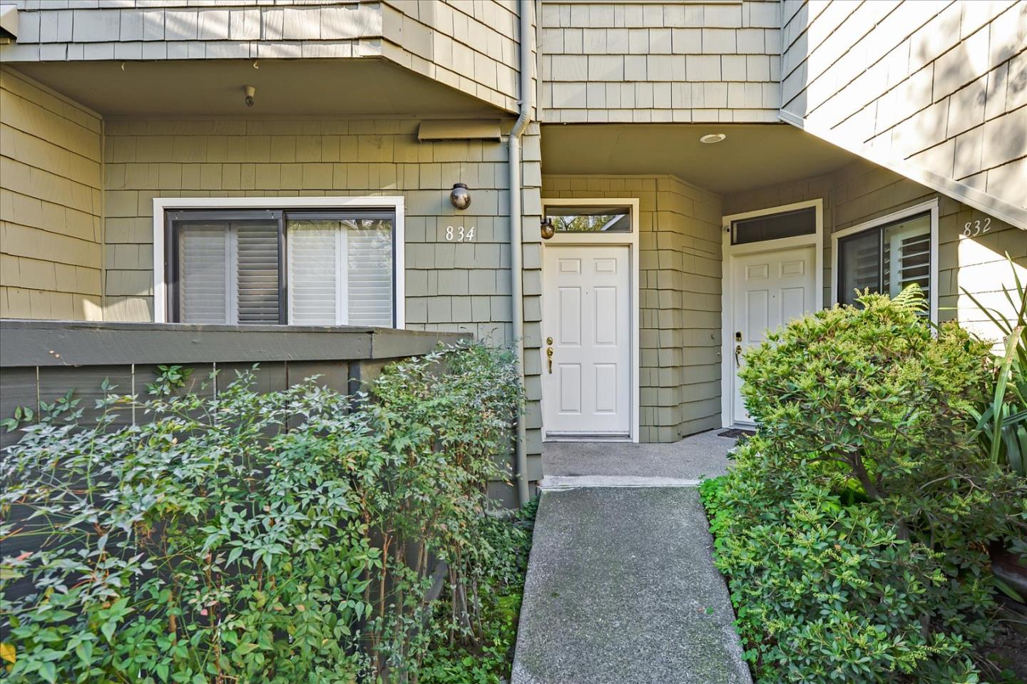 834 Wharfside Road San Mateo, CA 94404 - Photo 2 of 36 a front view of a house with garden