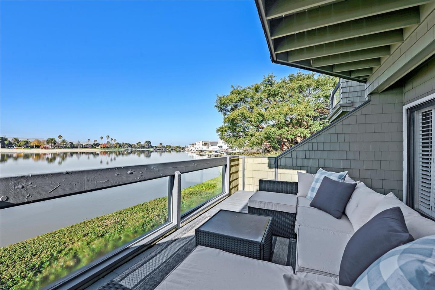 834 Wharfside Road San Mateo, CA 94404 - Photo 3 of 36 a balcony with furniture and a potted plant