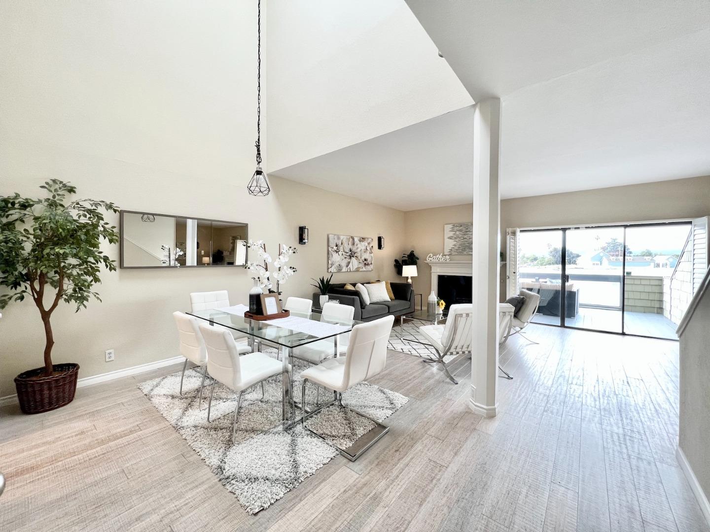 834 Wharfside Road San Mateo, CA 94404 - Photo 8 of 36 a living room with fireplace furniture and a wooden floor