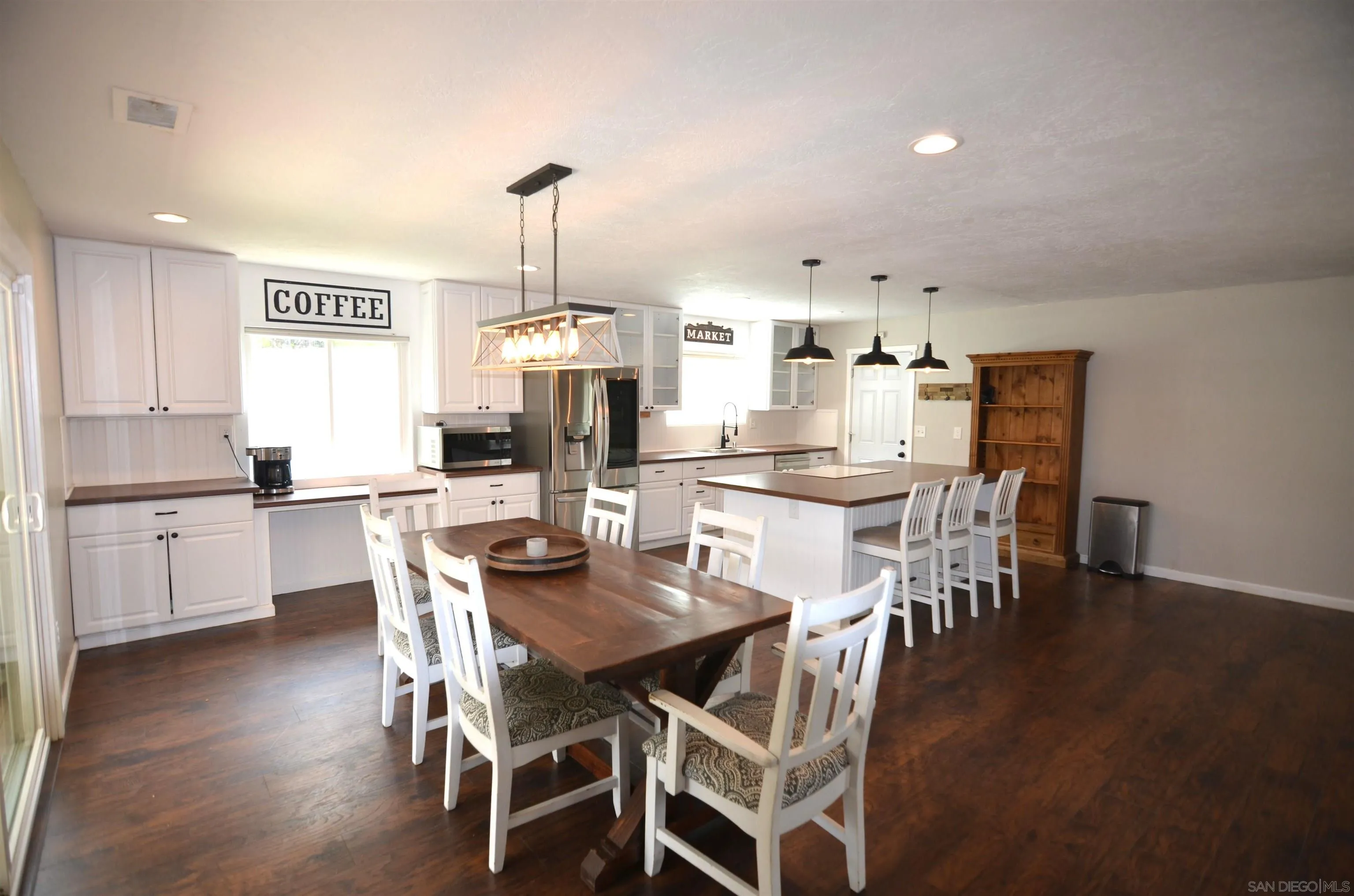 30643 Rabbit Run Valley Center, CA 92082 - Photo 1 of 59 a view of a dining room with furniture window and wooden floor