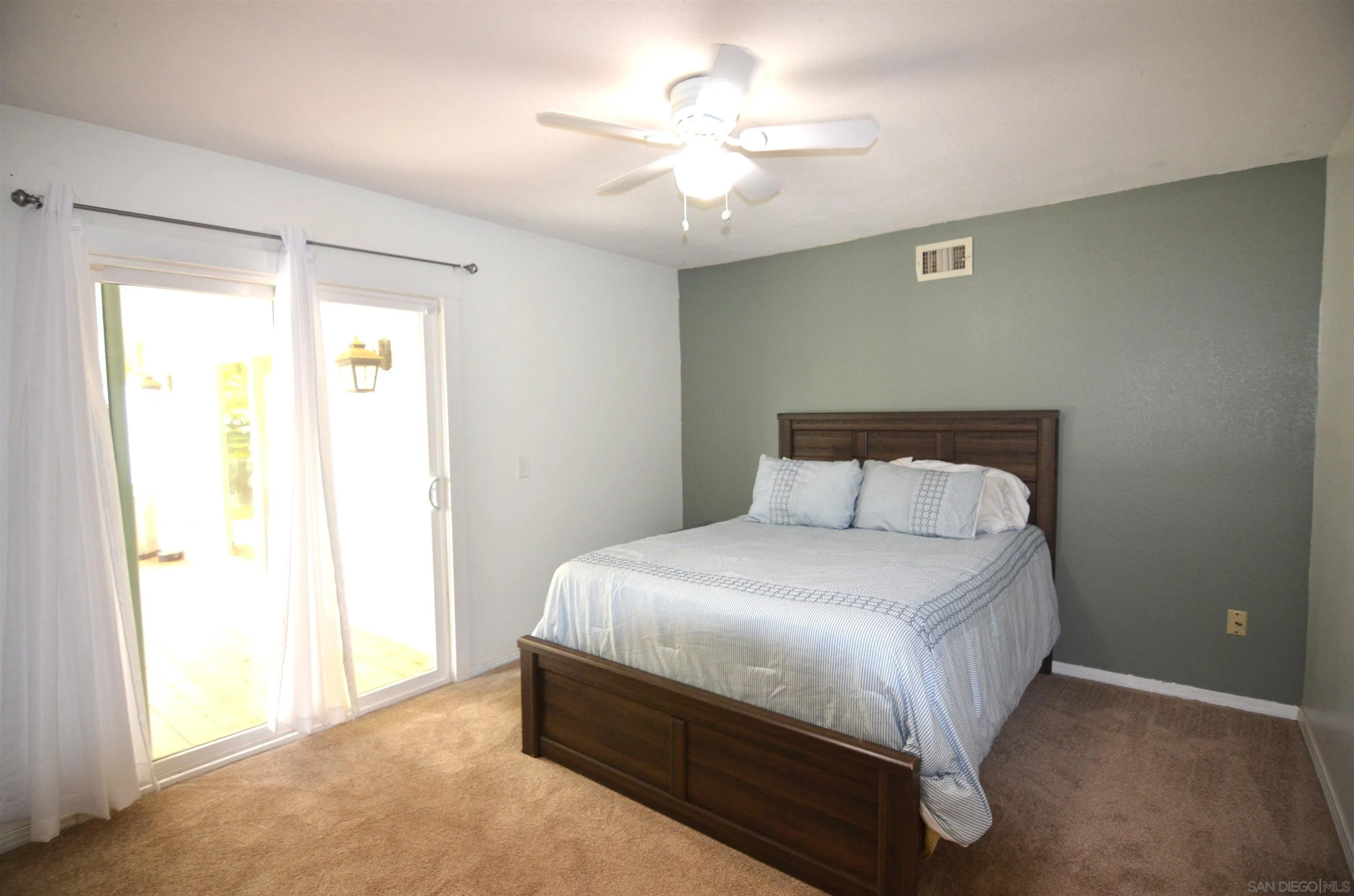 30643 Rabbit Run Valley Center, CA 92082 - Photo 17 of 59 a bedroom with a bed and a ceiling fan