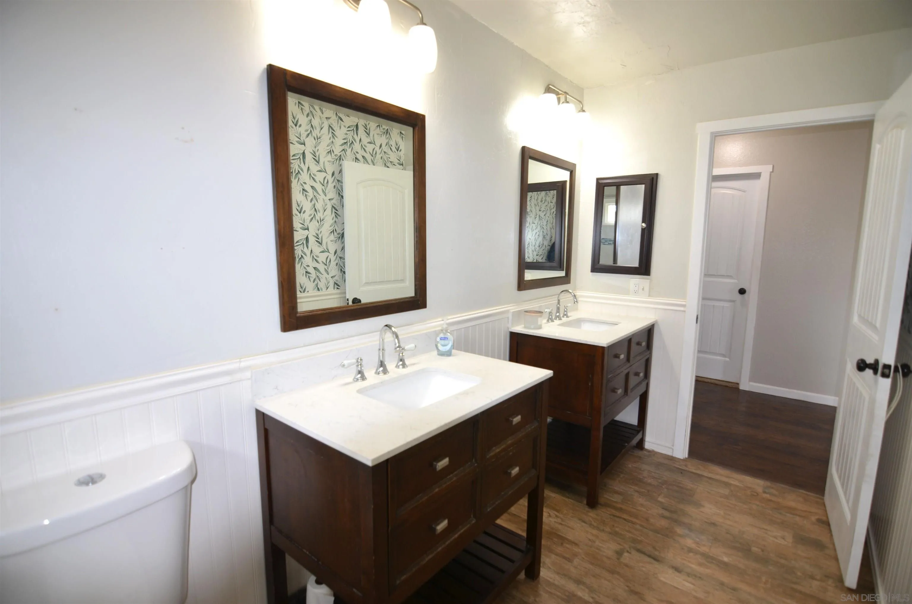 30643 Rabbit Run Valley Center, CA 92082 - Photo 20 of 59 a bathroom with a sink vanity and a mirror