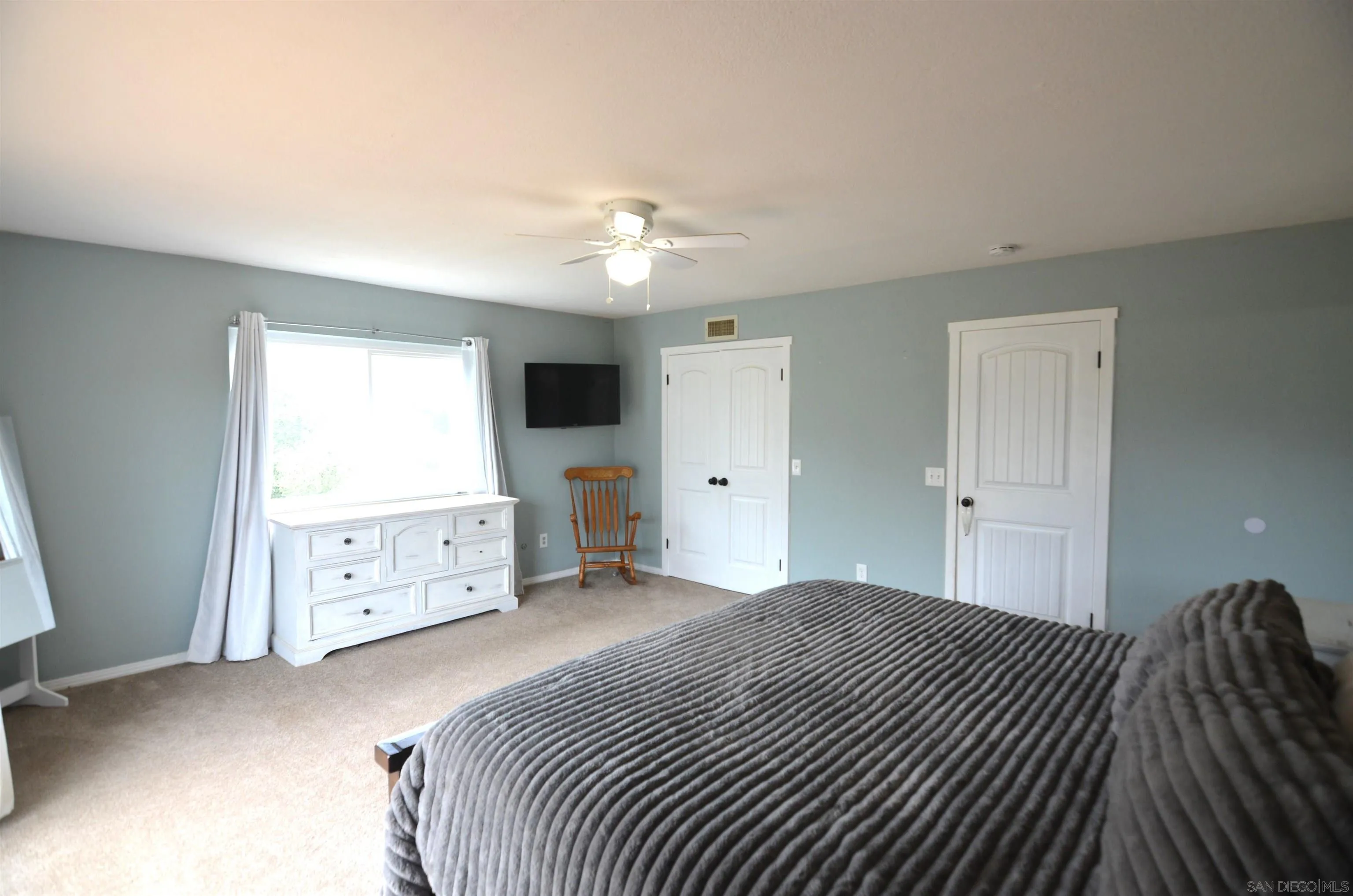30643 Rabbit Run Valley Center, CA 92082 - Photo 25 of 59 a bedroom with a bed and a window