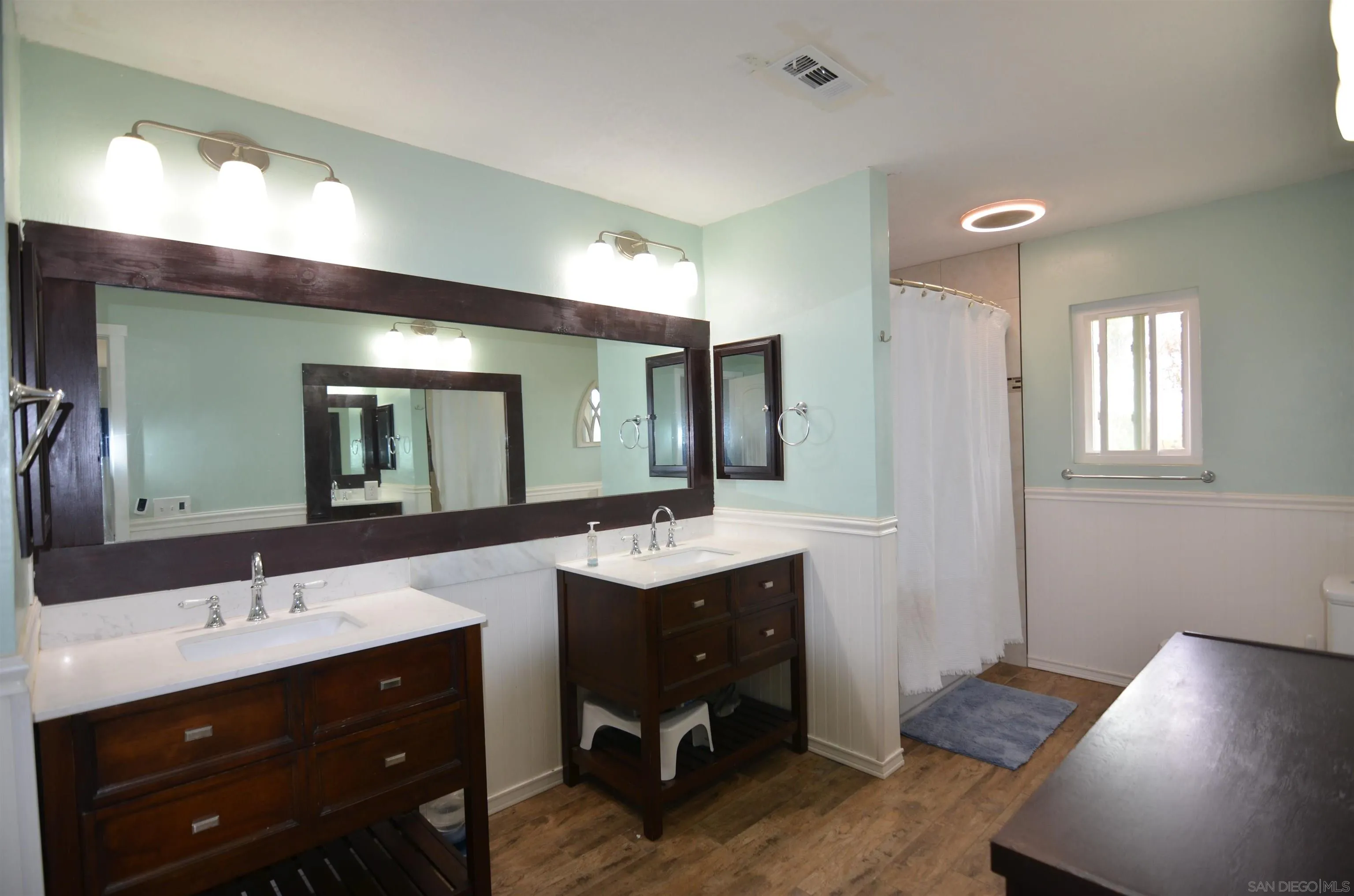30643 Rabbit Run Valley Center, CA 92082 - Photo 27 of 59 a bathroom with a sink double vanity and a mirror