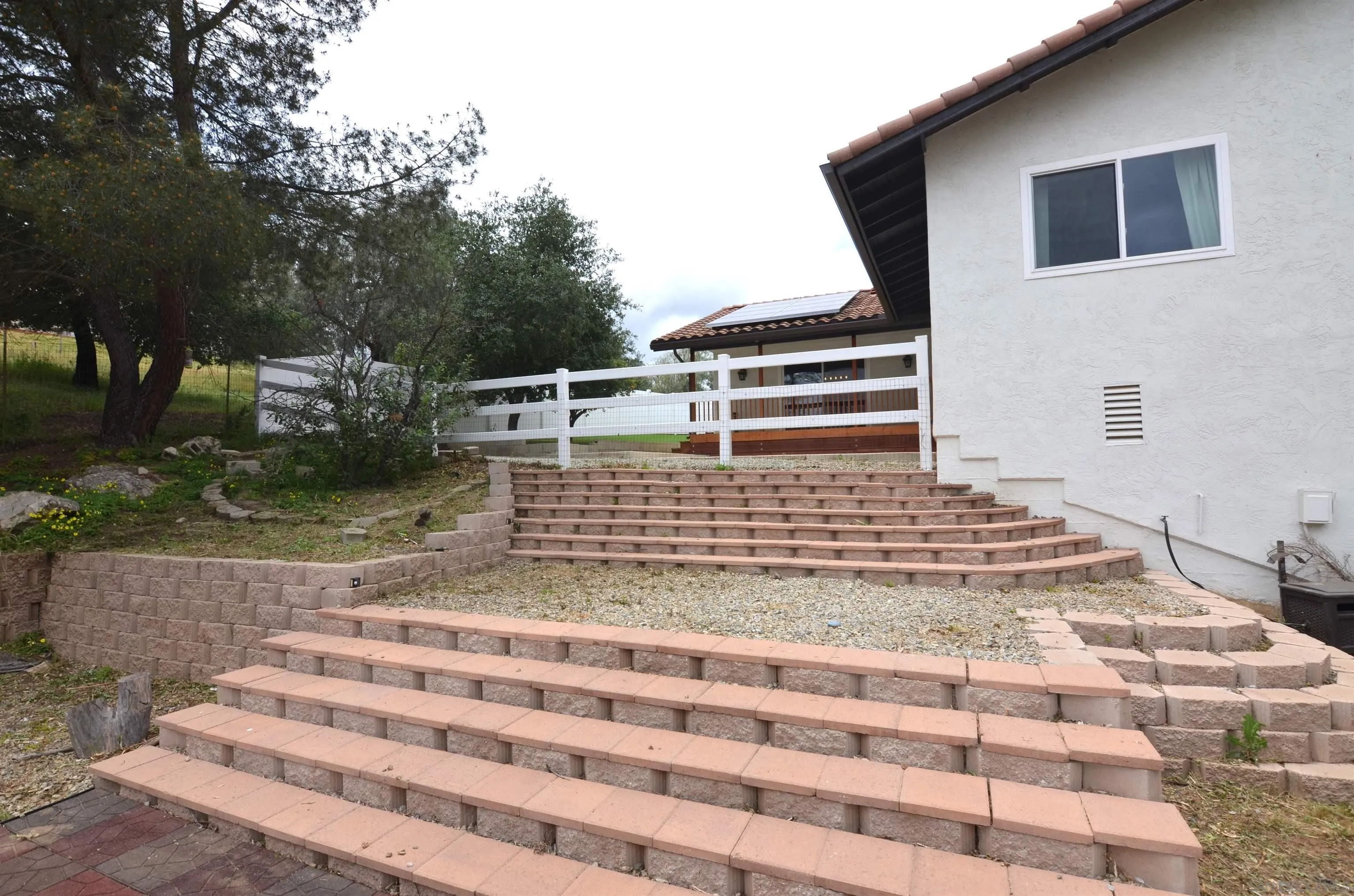 30643 Rabbit Run Valley Center, CA 92082 - Photo 49 of 59 a view of a backyard with white house